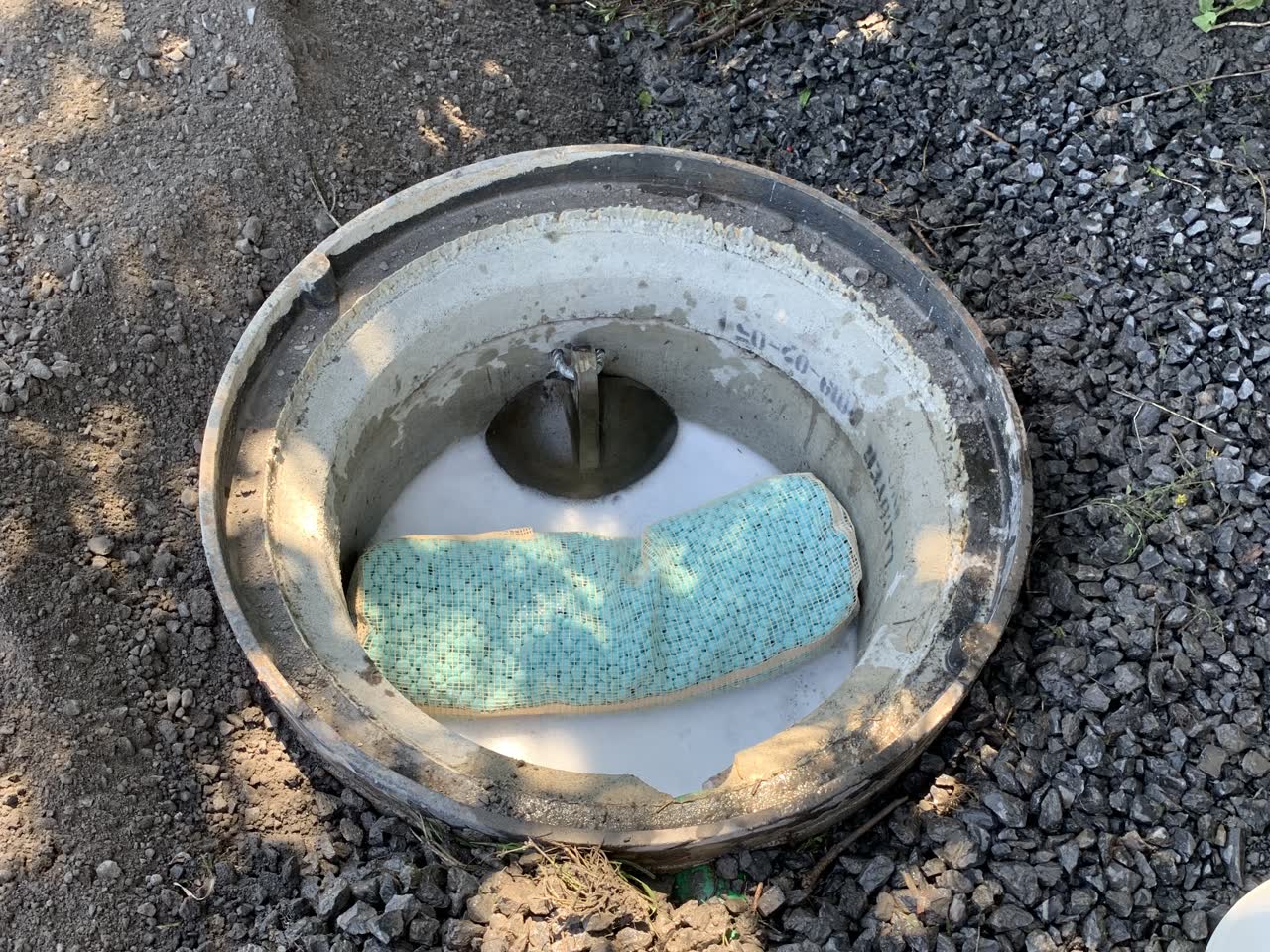 RHST treatment unit installed in a stormwater catch basin, with the WaterPearls sorbent stage floating inside